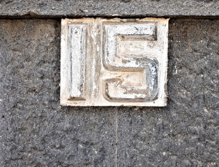 Number 15, decimal fifteen in white digits on gray background.