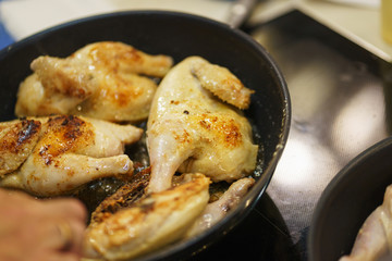 Process of cooking and roasting meat in a pan. 
