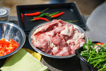 Chunks of fresh meat in a frying pan.