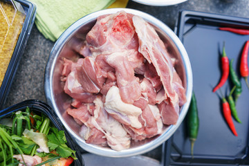 Chunks of fresh meat in a frying pan.