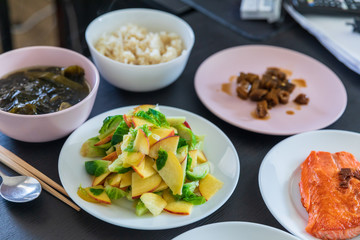 Small cabbage salad with sliced peach and various side dishes, Korean food