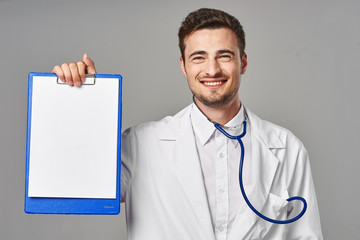 young doctor with clipboard