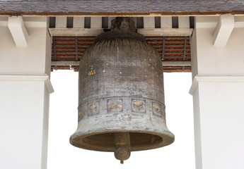 Obraz premium Old church bell isolated on white in the temple of lamphun, thailand