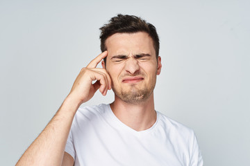 Fototapeta premium young man talking on the phone isolated on white