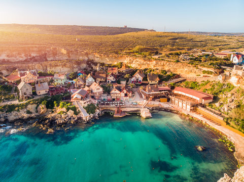 Village Popeye bay panorama Malta sunset, Il-Mellieha. Aerial top view