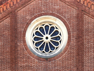 Circle window on brick wall