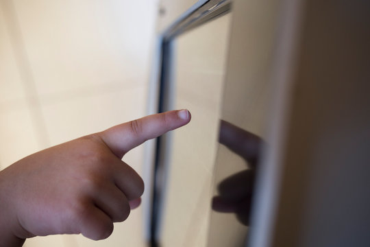 3 years boy using education interactive touch screen