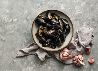 Fresh mussel, sea food,  with garlic ready to be cooked, top view, copy space      