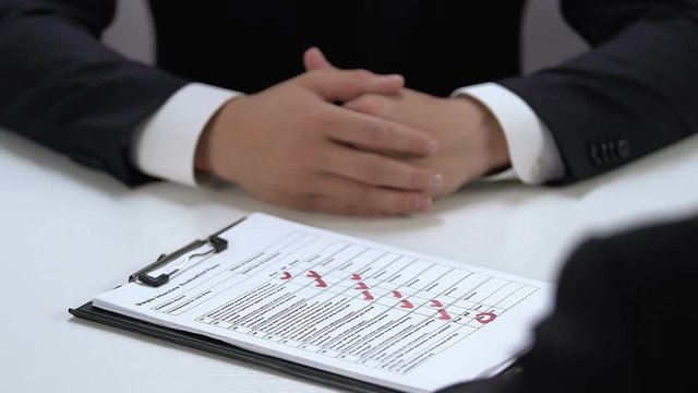 Manager refusing job candidate filling interview evaluation form, hire personnel