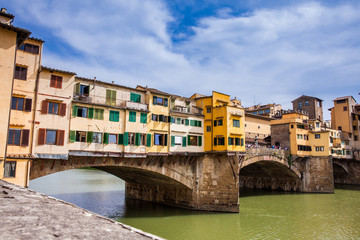 Fototapeta na wymiar Ponte Vecchio a medieval stone closed-spandrel segmental arch bridge over the Arno River in Florence