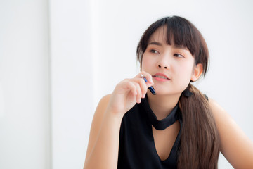 Beautiful asian woman writer thinking idea and writing on notebook or diary with happy on desk office, lifestyle of asia girl is success, female planning working, education and business concept.