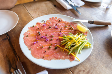 Beef carpaccio, beef tenderloin, zucchini, capers
