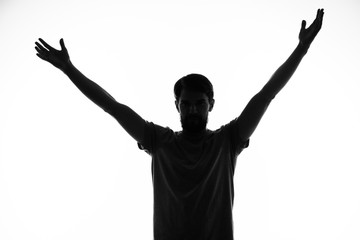 Fototapeta na wymiar silhouette of man with arms raised