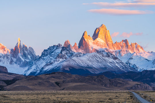 Beautiful Dawn Golden Orange Light Of Sun Rise Over The Fitz Roy And Cerro Torre Peak Snow Mountain In The Morning Beside The Route 40 Road From El Calafate To El Chalten, South Patagonia, Argentina