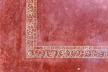A hand painted ancient Roman pattern on stucco in Pompeii, Italy