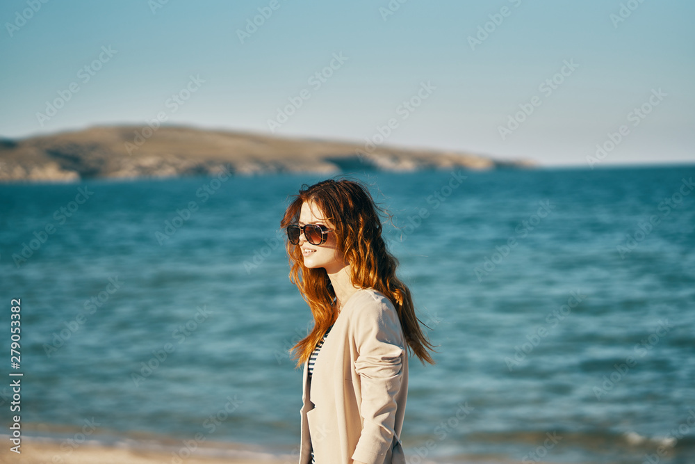 Wall mural woman on the beach