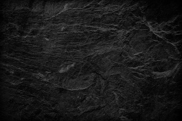 Dark grey black slate background or texture. black stone