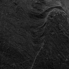 Dark grey black slate background or texture. black stone