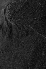 Dark grey black slate background or texture. black stone