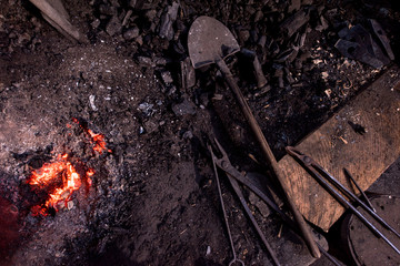 top view of traditional blacksmith furnace with burning fire