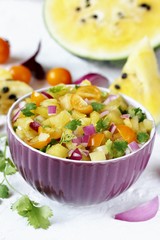 salsa salad of yellow watermelon. watermelon salsa. yellow watermelon. unusual dish. square format