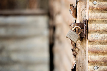 Rusty closed lock on a gate