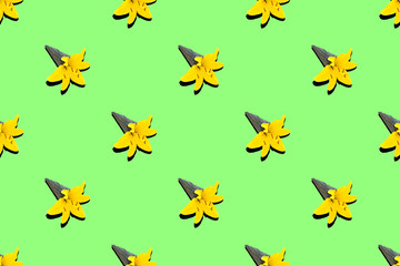 Pattern black ice cream cone with yellow lily flower on green neon background..