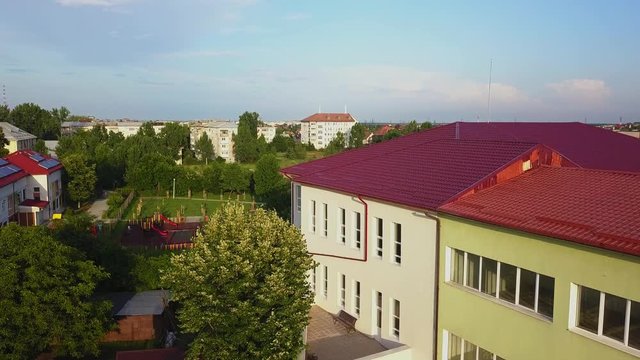 Aerial view of Slatina city and river Olt, Romania. Drone flight over the european city in summer day.