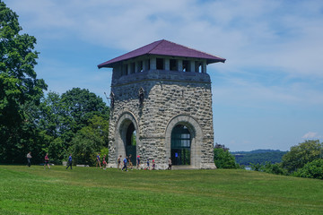 Fototapeta na wymiar Newburgh, New York: Tourists visit the restored Tower of Victory at Washington's Headquarters National Historic Landmark.