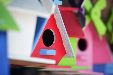 Obraz na płótnie Canvas colorful wooden bird house background.