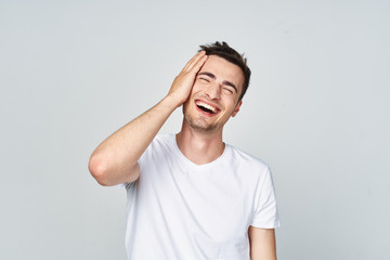 Fototapeta premium portrait of a young man with hands on his head