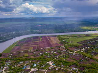 Arial view over the river and small village.