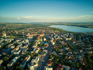 Aerial view of Slatina city and river Olt, Romania. Drone flight over the european city in summer day.