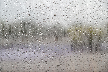 Obraz na płótnie Canvas Water drop on glass windows