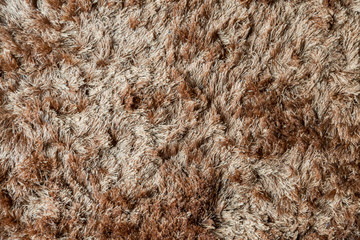 Brown fabric carpet with long pile texture