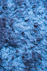Blue fabric carpet with long pile texture