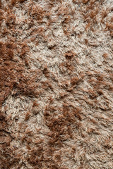Brown fabric carpet with long pile texture
