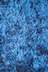 Blue fabric carpet with long pile texture
