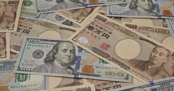 Stack of Japanese yen and USD