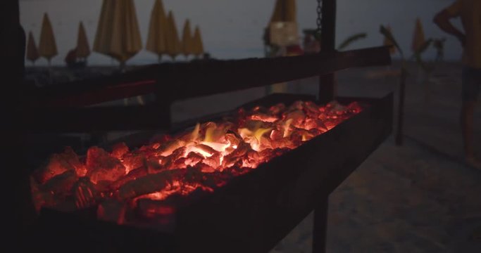 BBQ Grill at the beach - evening - slow motion