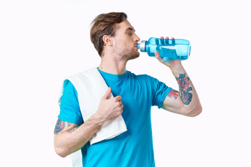 young man with bottle of water isolated on white