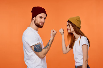 couple painting wall with paint roller