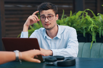 portrait of young man with laptop