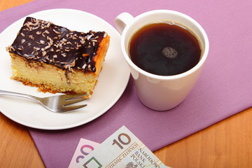 Paying for cheesecake and coffee in the cafe. Finance concept