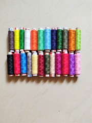 colorful thread rolls essential for sewing