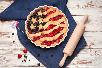 Tasty American flag pie on wooden background