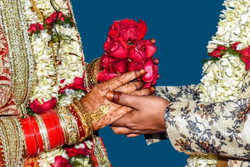 Young man giving a red rose, a bouquet of flowers to his girlfriend