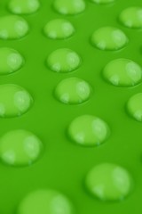 Green drop. Round water drops set on green background. Drops pattern.Ecology, nature and environment. Abstract background.Water Drops on Green Surface