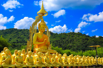 golden Buddha statue with among small 1,250 Buddha statue at Makha Bucha Buddhist memorial park located at nakhon nayok province, Thailand