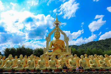 golden Buddha statue with among small 1,250 Buddha statue at Makha Bucha Buddhist memorial park located at nakhon nayok province, Thailand